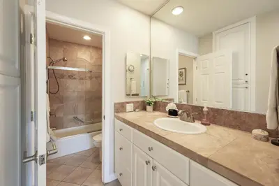 a bathroom with a sink and a toilet and a shower at Oceanside Beach Condos in Oceanside