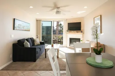 a living room with a couch and a table at Oceanside Beach Condos in Oceanside