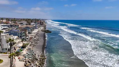 an aerial view of a beach with houses and the ocean at Beachfront Retreat in Oceanside