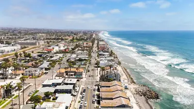 an aerial view of the beach and the ocean at Beachfront Retreat in Oceanside