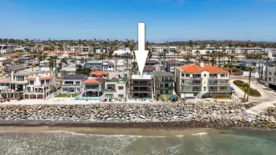 an aerial view of a beach with houses and condos at Beachfront Retreat in Oceanside