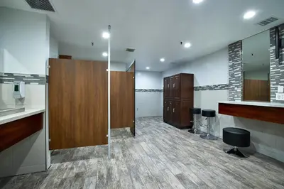 a large bathroom with wooden cabinets and a counter at Oceanside Beach Condos in Oceanside