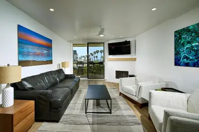a living room with a couch and a table at Oceanside Beach Condos in Oceanside