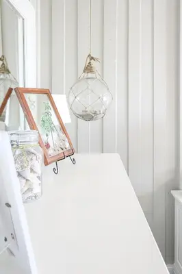 a room with a table with a picture and lights at Oceanside Beach Condos in Oceanside