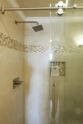 a shower with a glass door in a bathroom at Oceanside Beach Condos in Oceanside