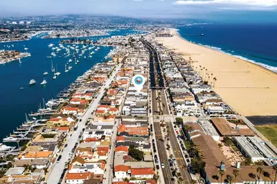 an aerial view of a harbor with a beach at Historical Beach Bungalow Steps Away From Sand #5 in Newport Beach