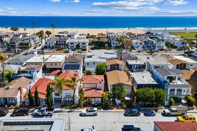 an aerial view of a town with a beach at Historical Beach Bungalow Steps Away From Sand #5 in Newport Beach