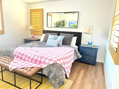 a bedroom with a bed with a checkered blanket at Comfort Retreat 3B3B Villa in Quail Hill Irvine in Irvine