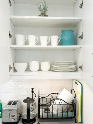 a kitchen pantry with plates and dishes on shelves at Comfort Retreat 3B3B Villa in Quail Hill Irvine in Irvine