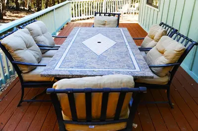 a table and four chairs on a deck at The Bungalow Partial Home Rental in Julian
