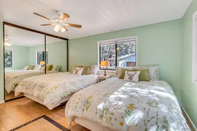 a bedroom with two beds and a ceiling fan at The Bungalow Partial Home Rental in Julian