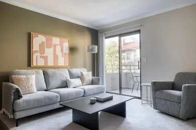 a living room with a couch and a table at Rancho Penasquitos 1br w pool gym nr bars SAN-31 in San Diego
