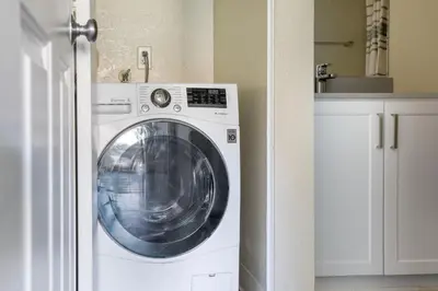 a white washing machine in a white kitchen at Rancho Penasquitos 1br w pool gym nr bars SAN-31 in San Diego