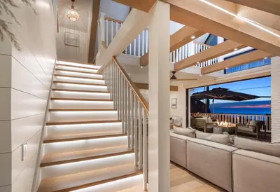 a staircase in a house with a view of the ocean at Neptune Ocean View Masterpiece in Encinitas