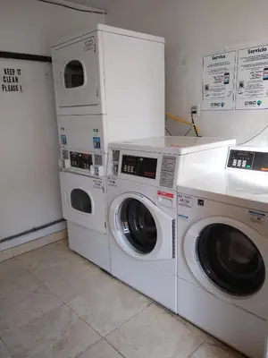 two washing machines sitting next to each other in a room at Charming 1Bedroom Vacation Condo in Oceanside