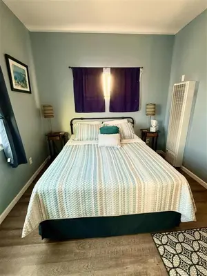 a bedroom with a large bed with a window at The studio apartment in Clairemont - New AC unit in San Diego