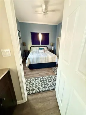 a bedroom with a bed and a ceiling fan at The studio apartment in Clairemont - New AC unit in San Diego