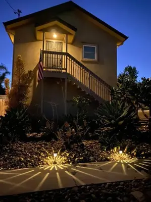 a house with a balcony with lights in front of it at The studio apartment in Clairemont - New AC unit in San Diego