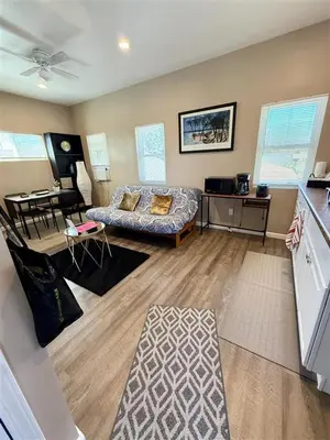 a living room with a couch and a table at The studio apartment in Clairemont - New AC unit in San Diego