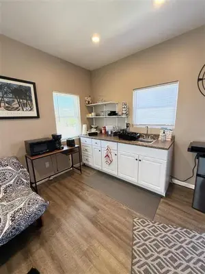 a kitchen with a counter and a sink in a room at The studio apartment in Clairemont - New AC unit in San Diego