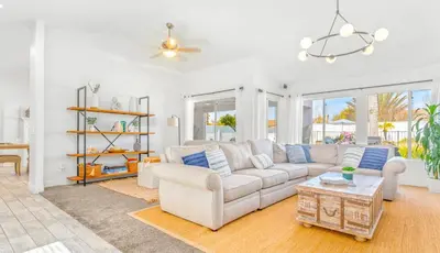 a living room with a couch and a table at Villa Descanso in Oceanside