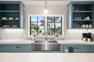 a kitchen with a sink and a window at Coastal La Jolla Luxury - AC & Large Ocean View Patio! in San Diego