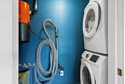 a washing machine and a washer and dryer in a room at Coastal La Jolla Luxury - AC & Large Ocean View Patio! in San Diego