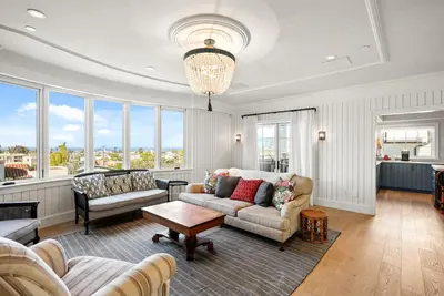 a living room with a couch and a table at Coastal La Jolla Luxury w AC, Patios, & Massive Ocean Views! in San Diego