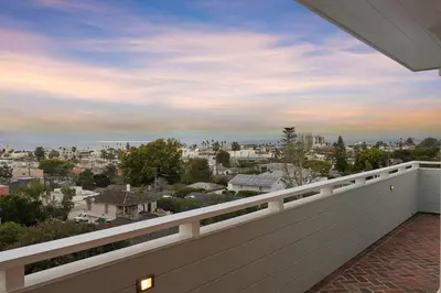 a balcony with a view of a city at Cabrillo Villa - Massive 7br La Jolla Estate in San Diego