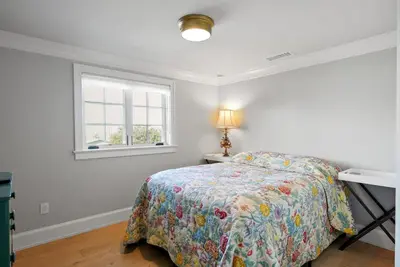 a bedroom with a bed and a window at Cabrillo Villa - Massive 7br La Jolla Estate in San Diego