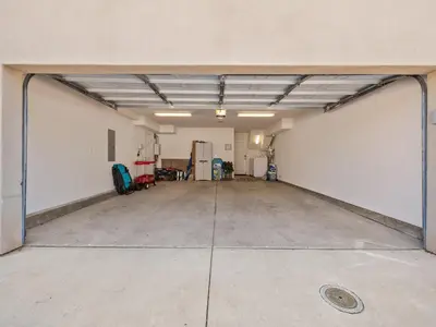 an empty garage with a large open door at Pacific Beach Dreaming - AC, walk 2 town, garage & beach in San Diego