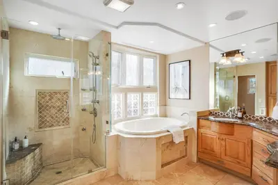 a large bathroom with a tub and a shower at Massive Dream Beach Home - Dog Friendly, AC, Steps2Sand in San Diego