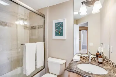 a bathroom with a toilet and a sink and a shower at Massive Dream Beach Home - Dog Friendly, AC, Steps2Sand in San Diego