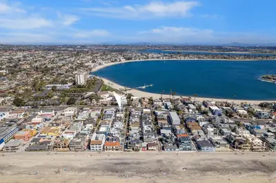 an aerial view of a beach and a harbor at Stunning Beach House- Rooftop Patio & Ocean Views in San Diego