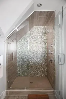 a bathroom with a shower with a glass door at Oceanfront, two-level condo with stunning view, decks, fast WiFi & fireplace in San Diego