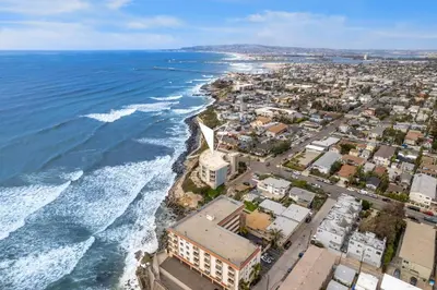 an aerial view of the beach and the ocean at Sunset Cliffs Lookout - Ocean Front Luxury Condo in San Diego