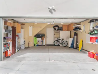 an open garage with a bike parked in it at Ocean View Beach Haven! Steps2Beach & Pet Friendly in San Diego