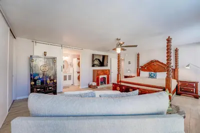 a living room with a couch and a bed at Bayfront Paradise - Flexible 30 Day plus w Amazing Bay View and Pool in San Diego