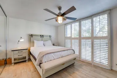 a bedroom with a bed and a ceiling fan at Bayfront Paradise - Flexible 30 Day plus w Amazing Bay View and Pool in San Diego
