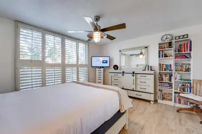 a bedroom with a bed and a ceiling fan at Bayfront Paradise - Flexible 30 Day plus w Amazing Bay View and Pool in San Diego