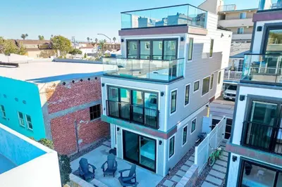 an aerial view of a building with a balcony at NEW Luxury Beach Home I 3BR I Balcony I Firepit in San Diego