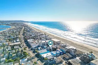 an aerial view of a beach and the ocean at Luxury Ocean Oasis 3BR I Balcony I Firepit in San Diego