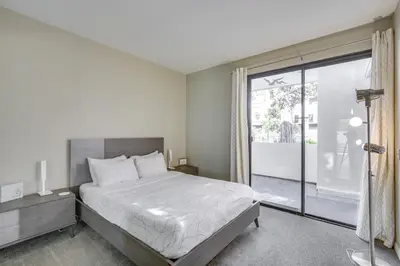 a bedroom with a bed and a large window at Downtown San Diego Condo 1 Mi to Gaslamp Quarter in San Diego