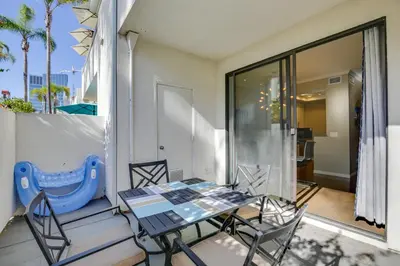a patio with a table and chairs on a balcony at Downtown San Diego Condo 1 Mi to Gaslamp Quarter in San Diego