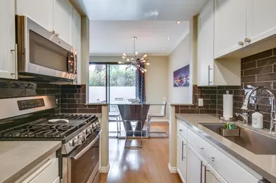 a kitchen with a stove and a sink at Downtown San Diego Condo 1 Mi to Gaslamp Quarter in San Diego