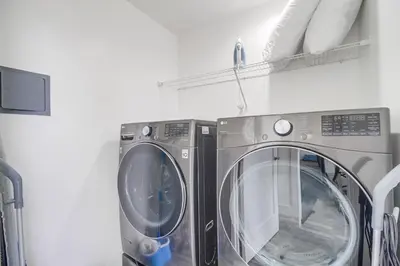 two washing machines sitting next to each other in a room at Park Blvd 301 - Modern - Urban Oasis - SPA in San Diego