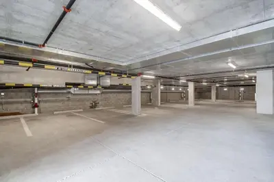 an empty parking lot in an empty parking garage at Park Blvd 301 - Modern - Urban Oasis - SPA in San Diego