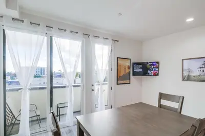 a dining room with a table and a large window at Park Blvd 302 - Newly Built - Spa - Central in San Diego