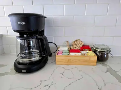 a coffee maker sitting on a counter next to a wooden box at Park Blvd Paradise 303 king bed With a private Spa in San Diego