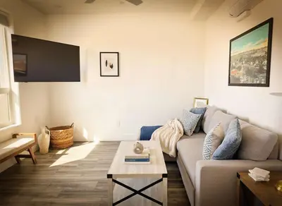 a living room with a couch and a coffee table at Park Blvd Paradise 303 king bed With a private Spa in San Diego